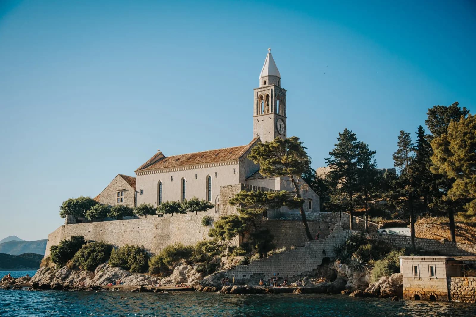Lopud waterfront and green hillside on a car-free island near Dubrovnik