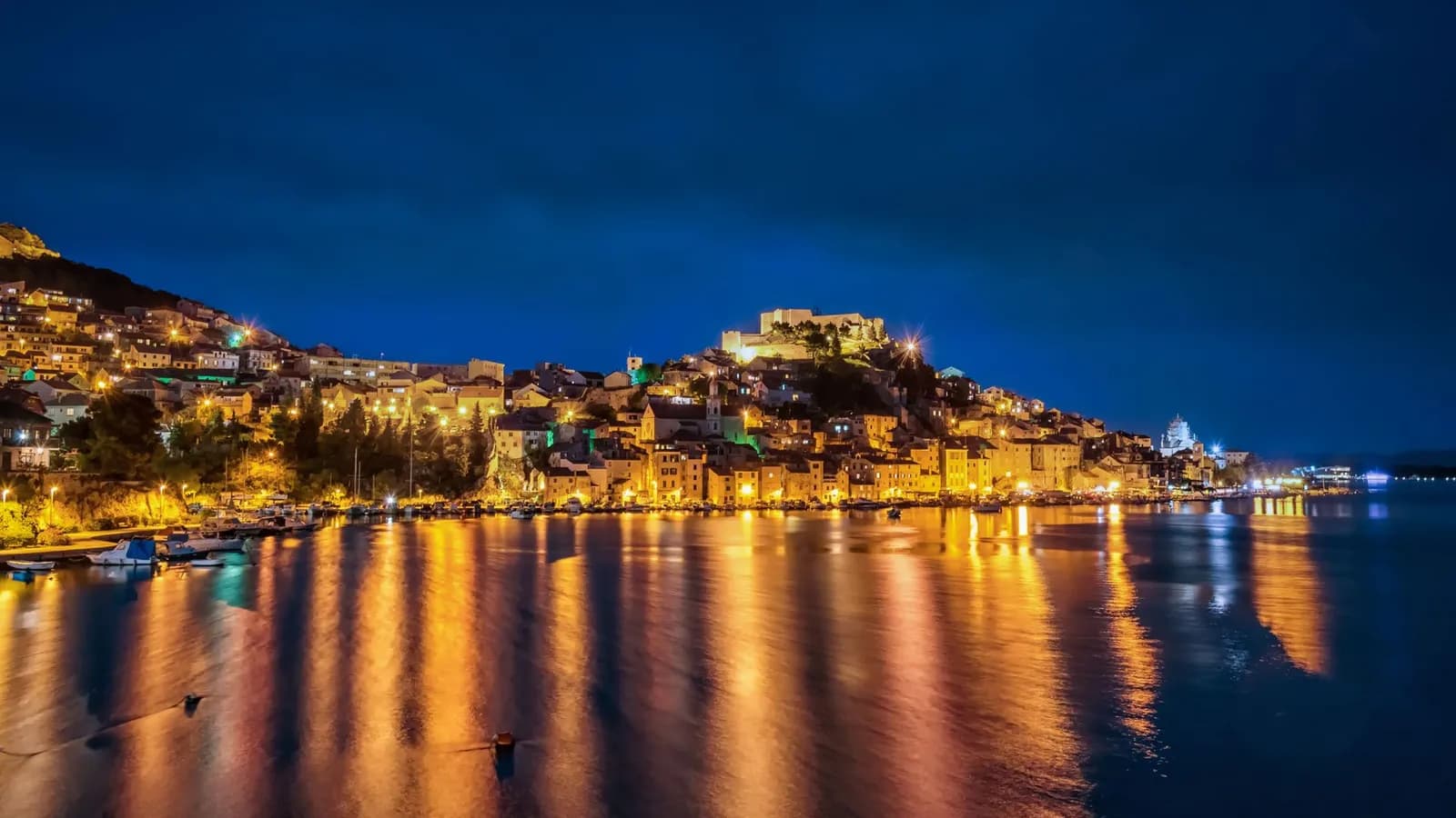 Night view of Sibenik old town and waterfront used for a Trogir versus Sibenik spring base guide